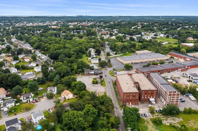an aerial view of residential houses with outdoor space
