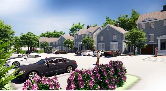 a couple of cars parked in front of a house