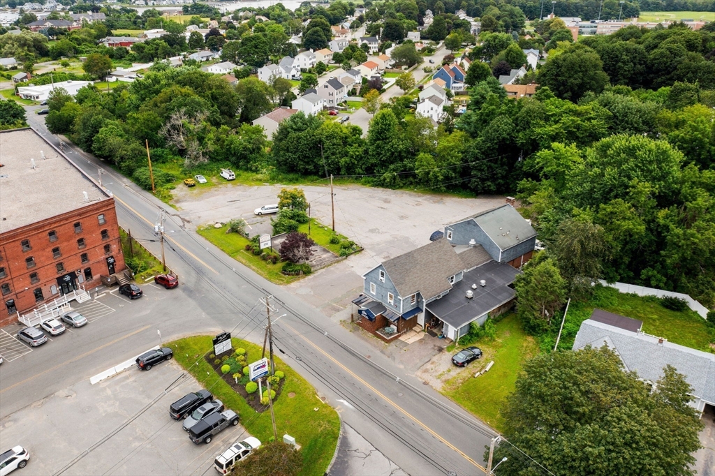 55 Pulaski Street Peabody, MA 01960 - Photo 5 of 21 an aerial view of a swimming pool with a yard