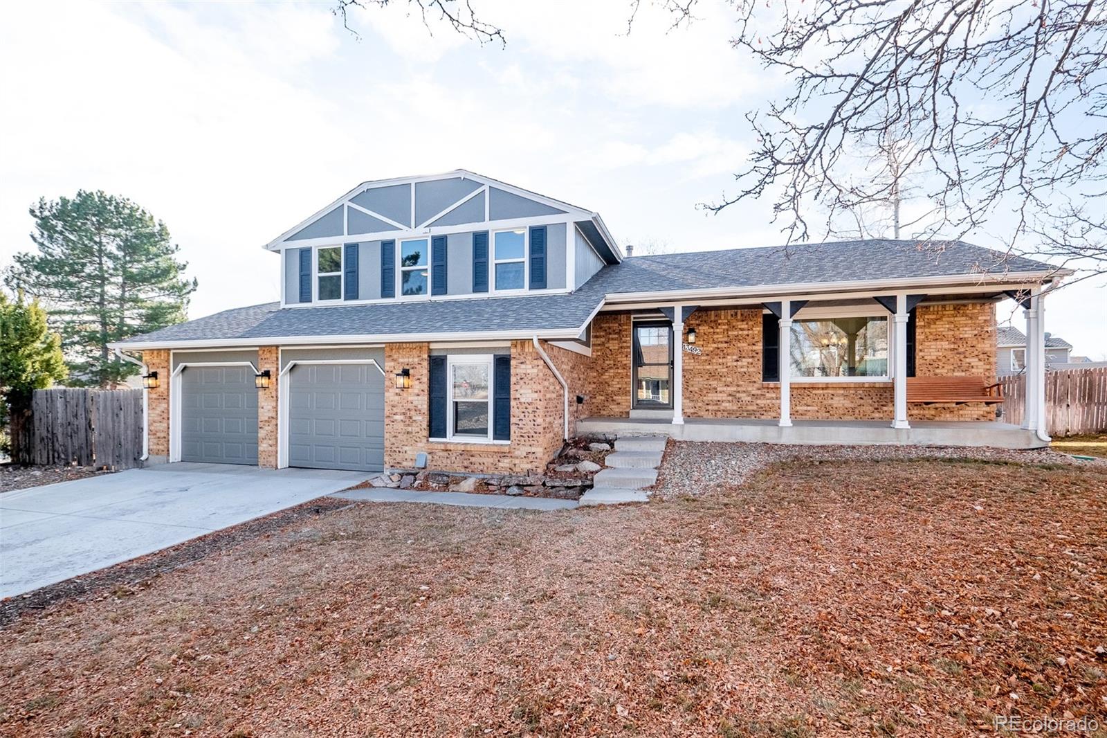 13492 Jackson Drive Thornton, CO 80241 - Photo 1 of 25 front view of a house with a yard
