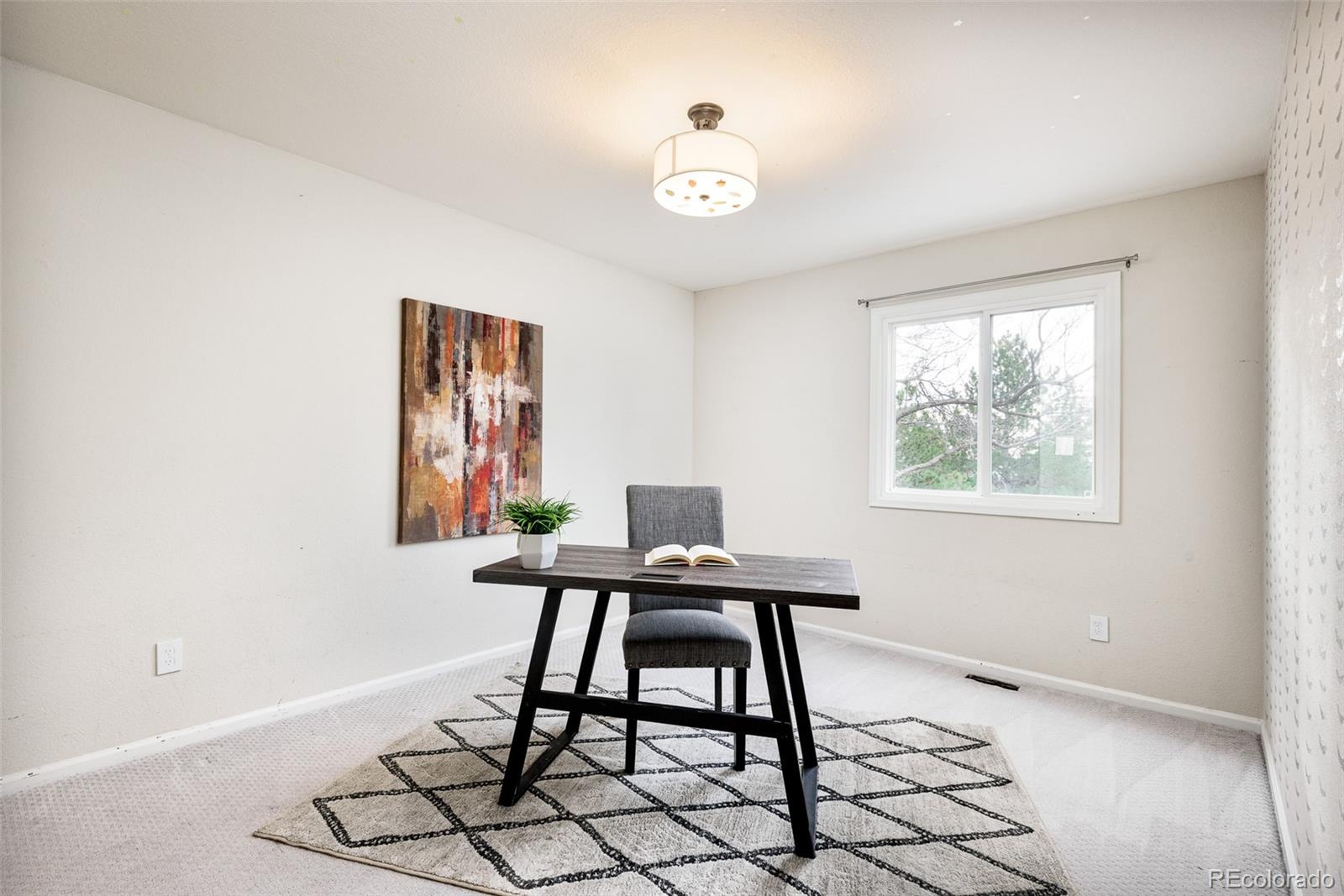 13492 Jackson Drive Thornton, CO 80241 - Photo 16 of 25 a workspace with furniture and window