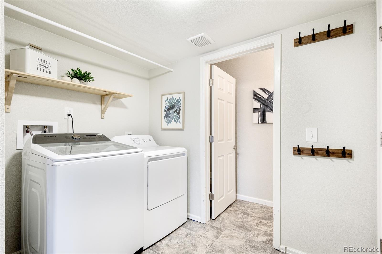13492 Jackson Drive Thornton, CO 80241 - Photo 20 of 25 a utility room with dryer and washer