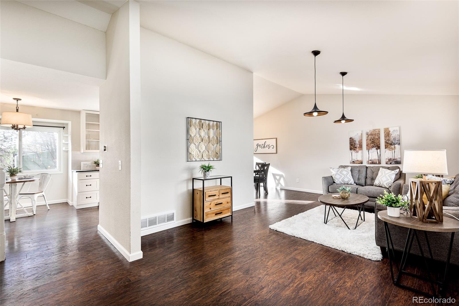13492 Jackson Drive Thornton, CO 80241 - Photo 2 of 25 a living room with furniture and wooden floor