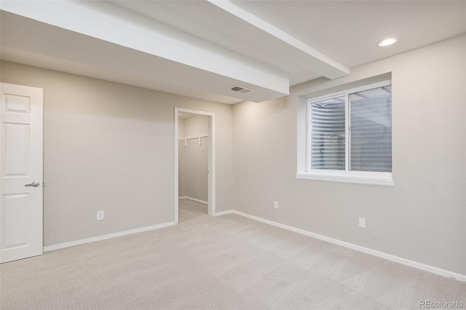 13492 Jackson Drive Thornton, CO 80241 - Photo 22 of 25 an empty room with windows