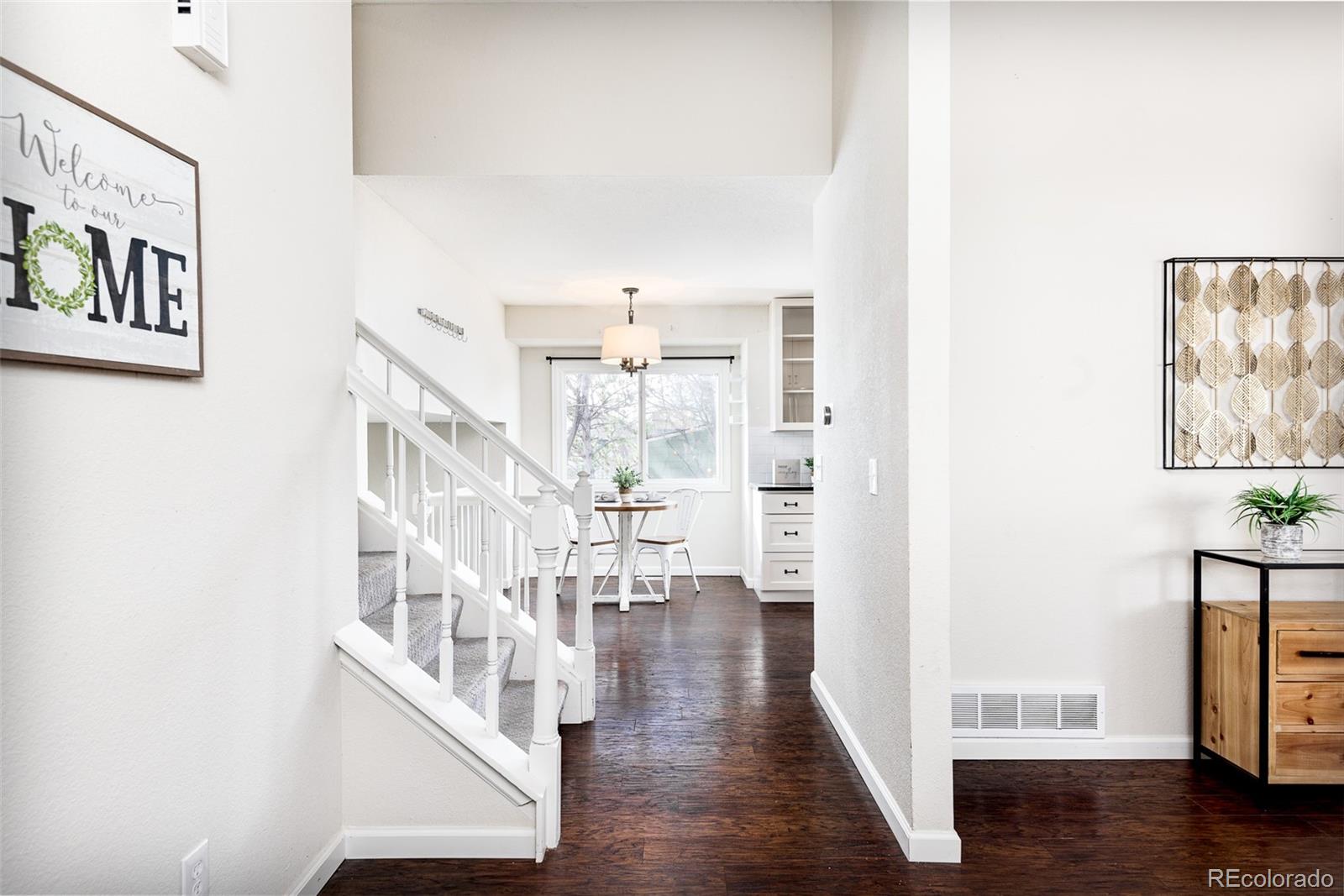 13492 Jackson Drive Thornton, CO 80241 - Photo 3 of 25 a view of entryway with wooden floor
