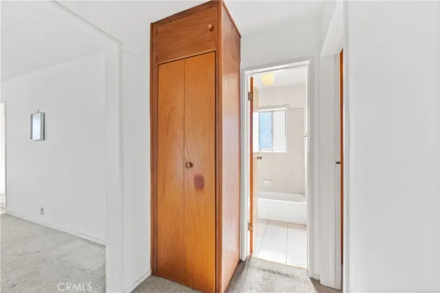 a view of a bathroom from a hallway