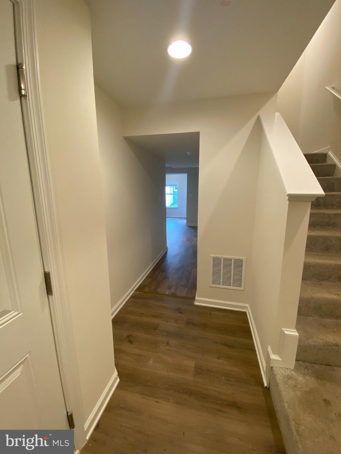 128 Tuxford Road Falling Waters, WV 25419 - Photo 7 of 27 Inviting hallway with warm tones.