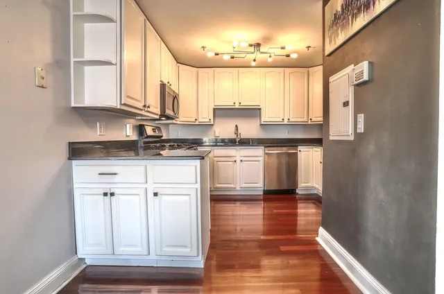 a view of a kitchen with washer and dryer