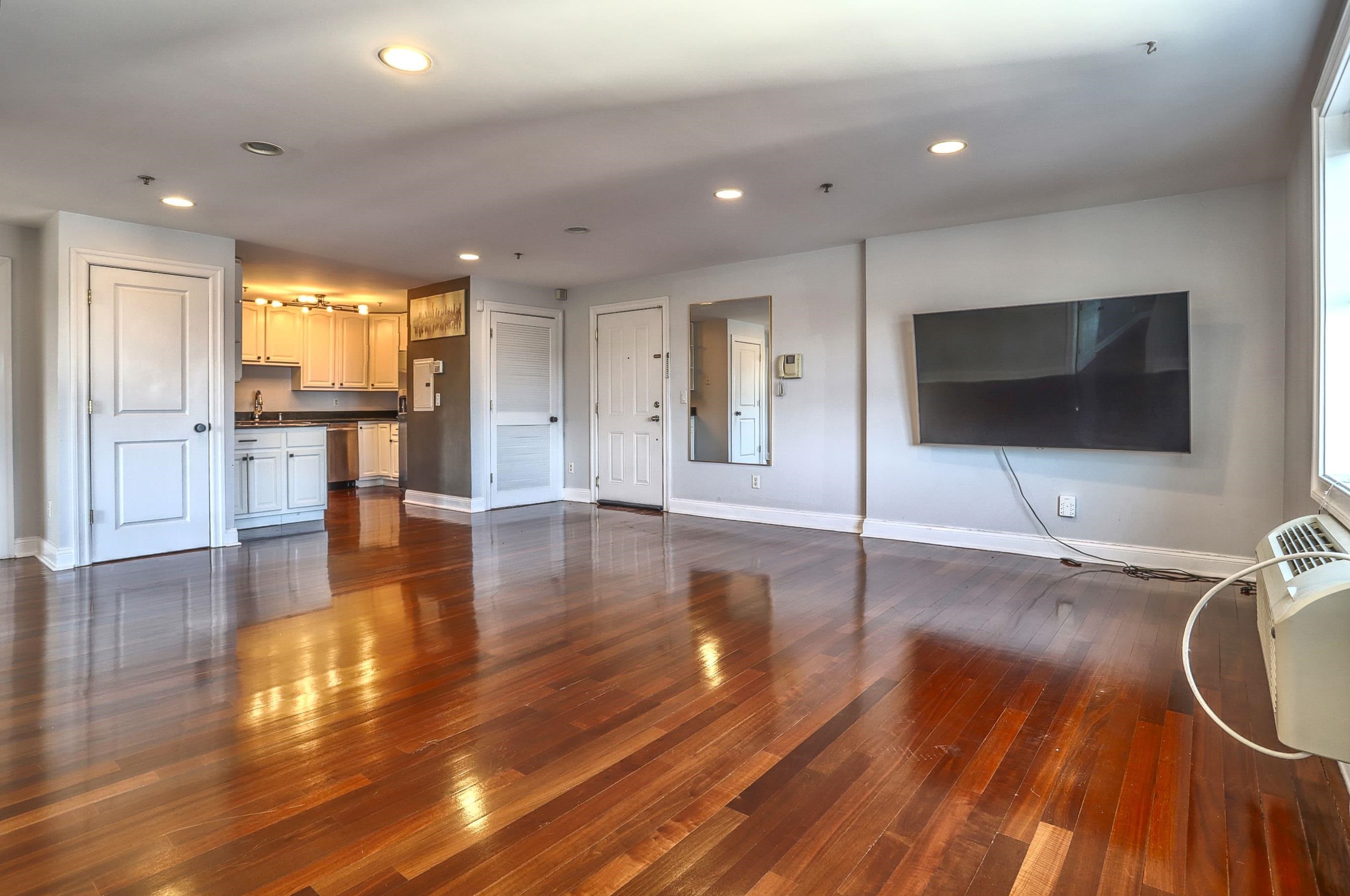 1720 New York Avenue, Unit 406 Union City, NJ 07087 - Photo 7 of 21 a view of a kitchen with a sink and a large window