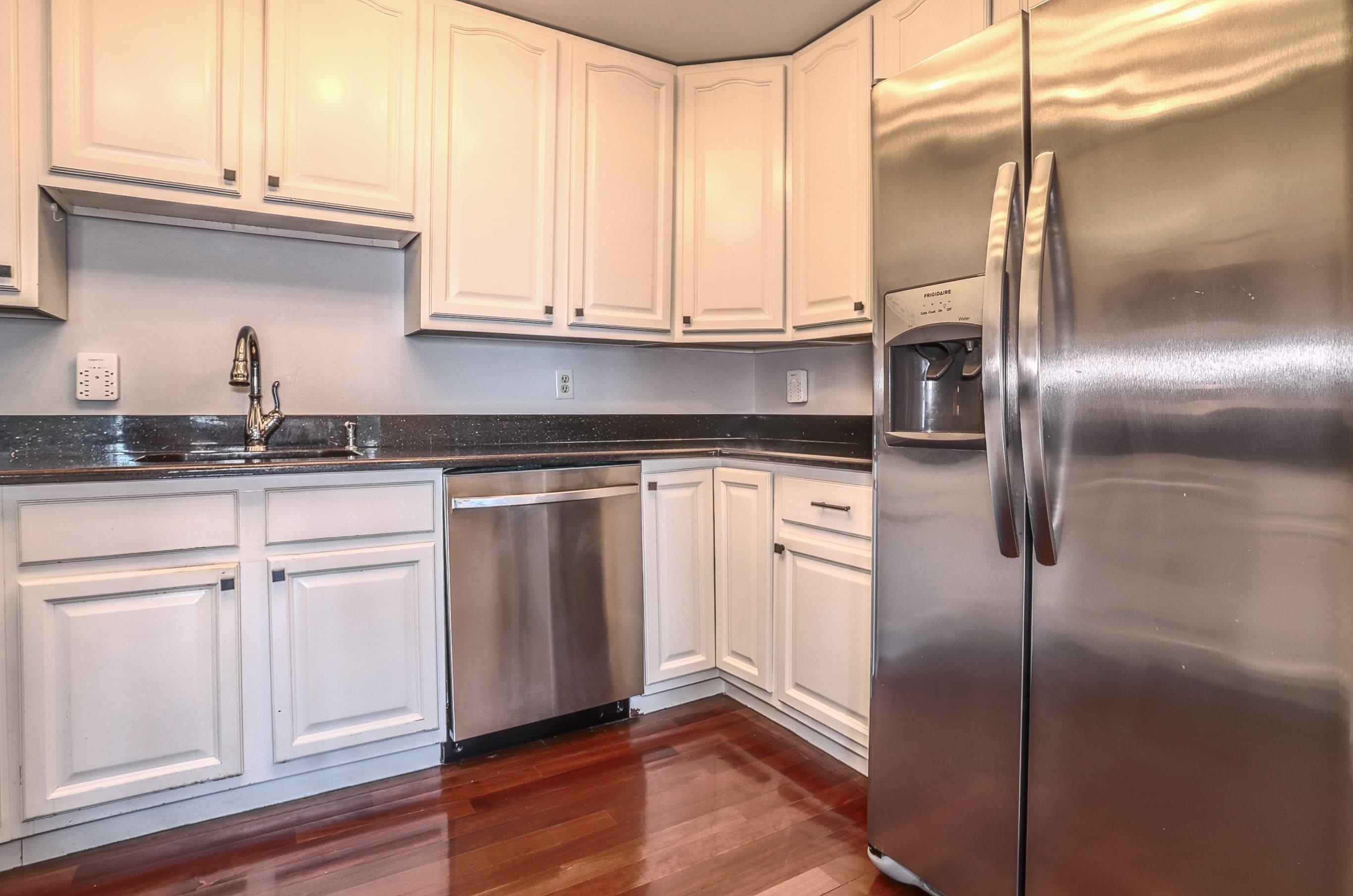 1720 New York Avenue, Unit 406 Union City, NJ 07087 - Photo 10 of 21 a kitchen with stainless steel appliances granite countertop a sink and a refrigerator