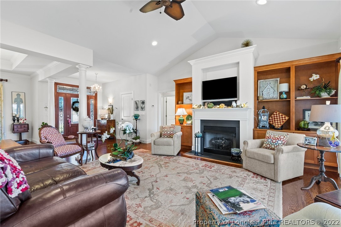 1570 Valley View Road Southern Pines, NC 28387 - Photo 12 of 44 a living room with furniture a fireplace and a flat screen tv