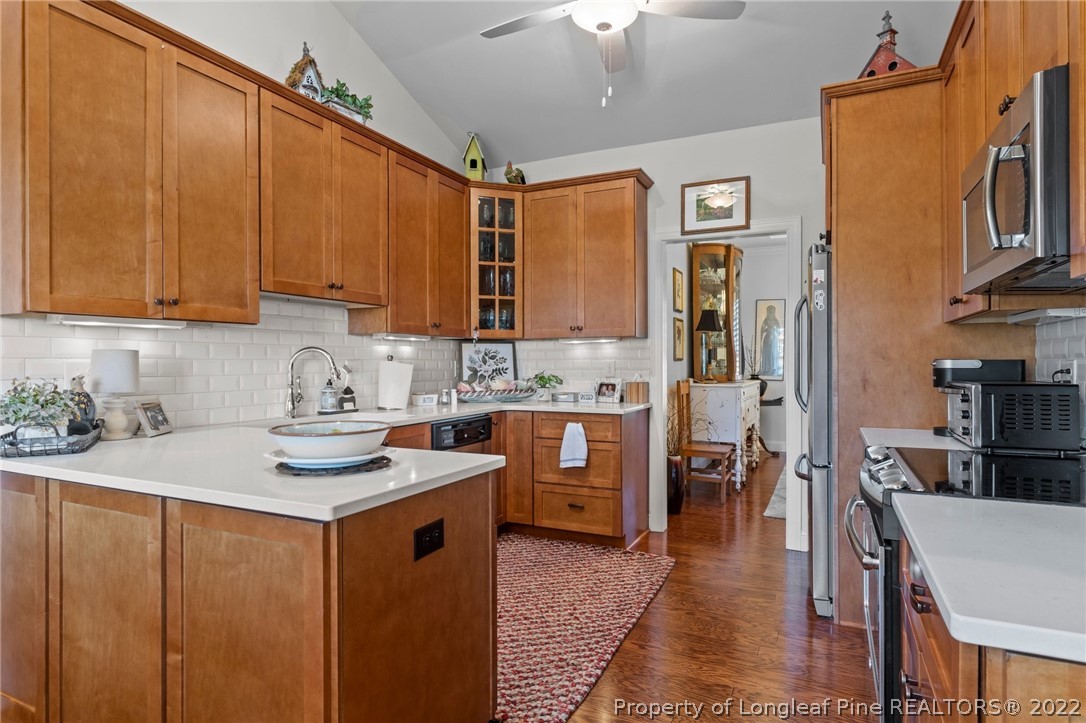 1570 Valley View Road Southern Pines, NC 28387 - Photo 16 of 44 a kitchen with stainless steel appliances granite countertop a sink stove and refrigerator