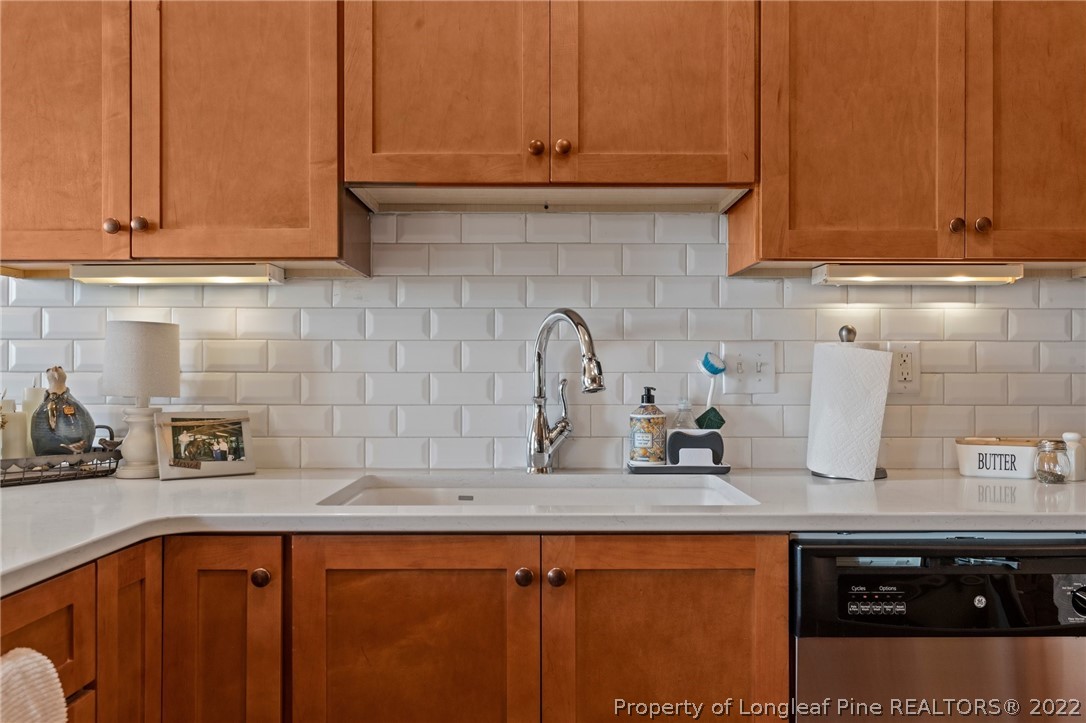 1570 Valley View Road Southern Pines, NC 28387 - Photo 17 of 44 a kitchen with stainless steel appliances granite countertop a sink a stove and cabinets