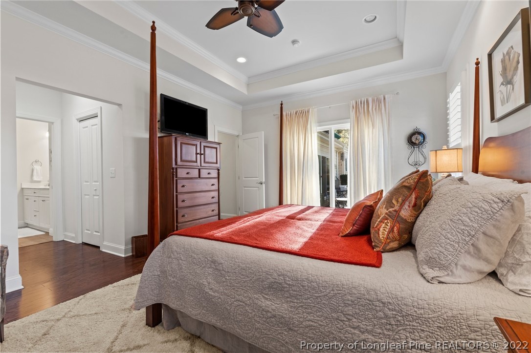 1570 Valley View Road Southern Pines, NC 28387 - Photo 24 of 44 a bedroom with a bed and a flat screen tv