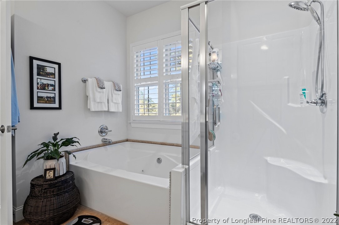 1570 Valley View Road Southern Pines, NC 28387 - Photo 26 of 44 a white bath tub sitting next to a shower