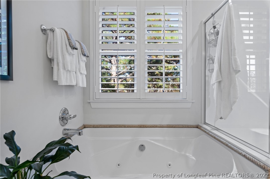 1570 Valley View Road Southern Pines, NC 28387 - Photo 27 of 44 a bathroom with a bathtub and a shower