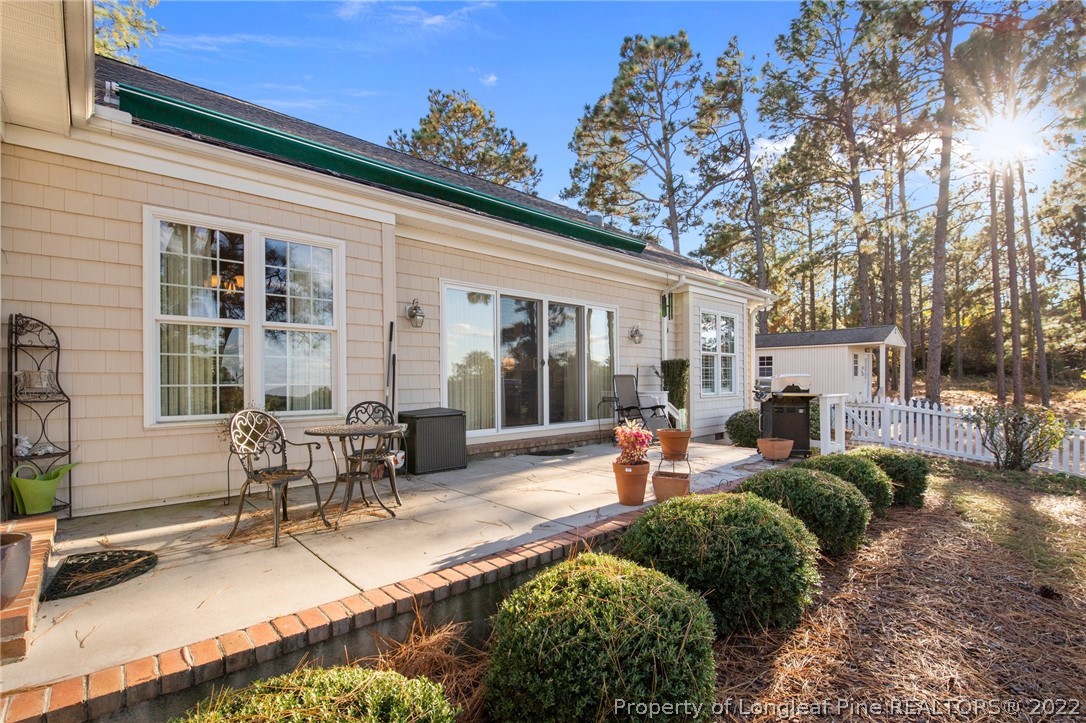 1570 Valley View Road Southern Pines, NC 28387 - Photo 35 of 44 a view of a house with backyard and sitting area