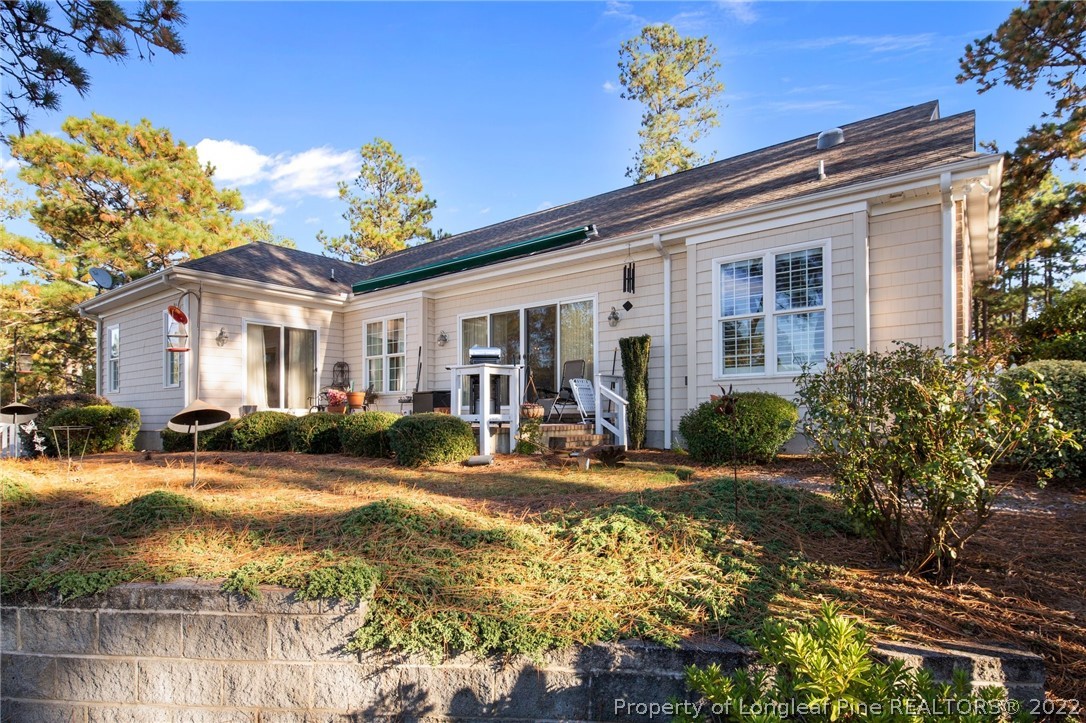 1570 Valley View Road Southern Pines, NC 28387 - Photo 36 of 44 a view of a house with pool and sitting area