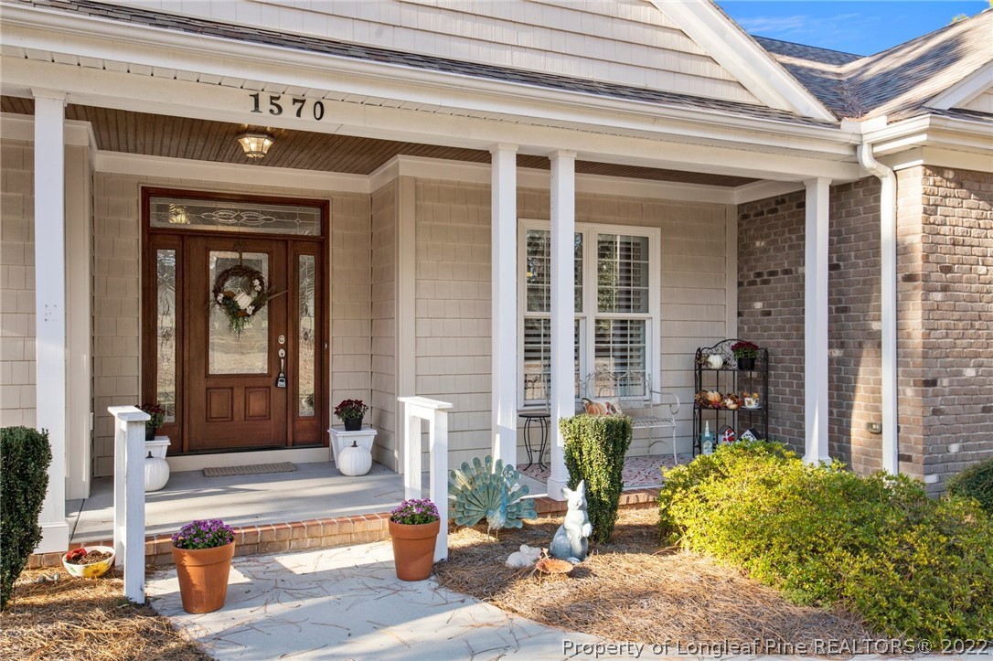 1570 Valley View Road Southern Pines, NC 28387 - Photo 4 of 44 a front view of a house with outdoor seating