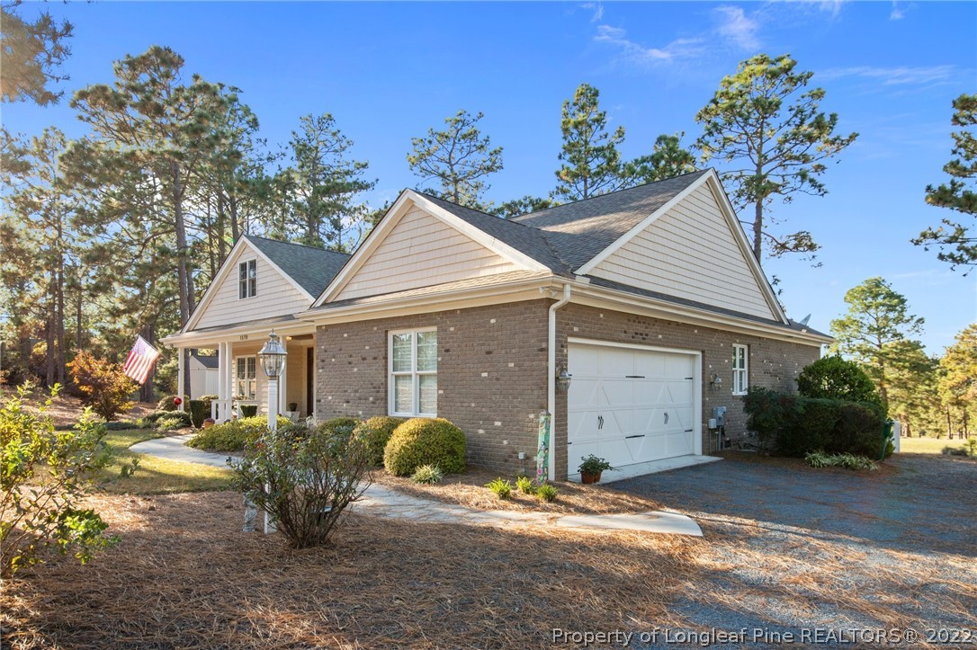1570 Valley View Road Southern Pines, NC 28387 - Photo 8 of 44 front view of a house with a yard