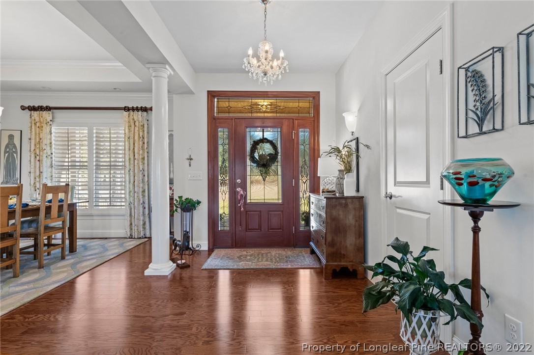 1570 Valley View Road Southern Pines, NC 28387 - Photo 9 of 44 a view of an entryway with wooden floor and a chandelier