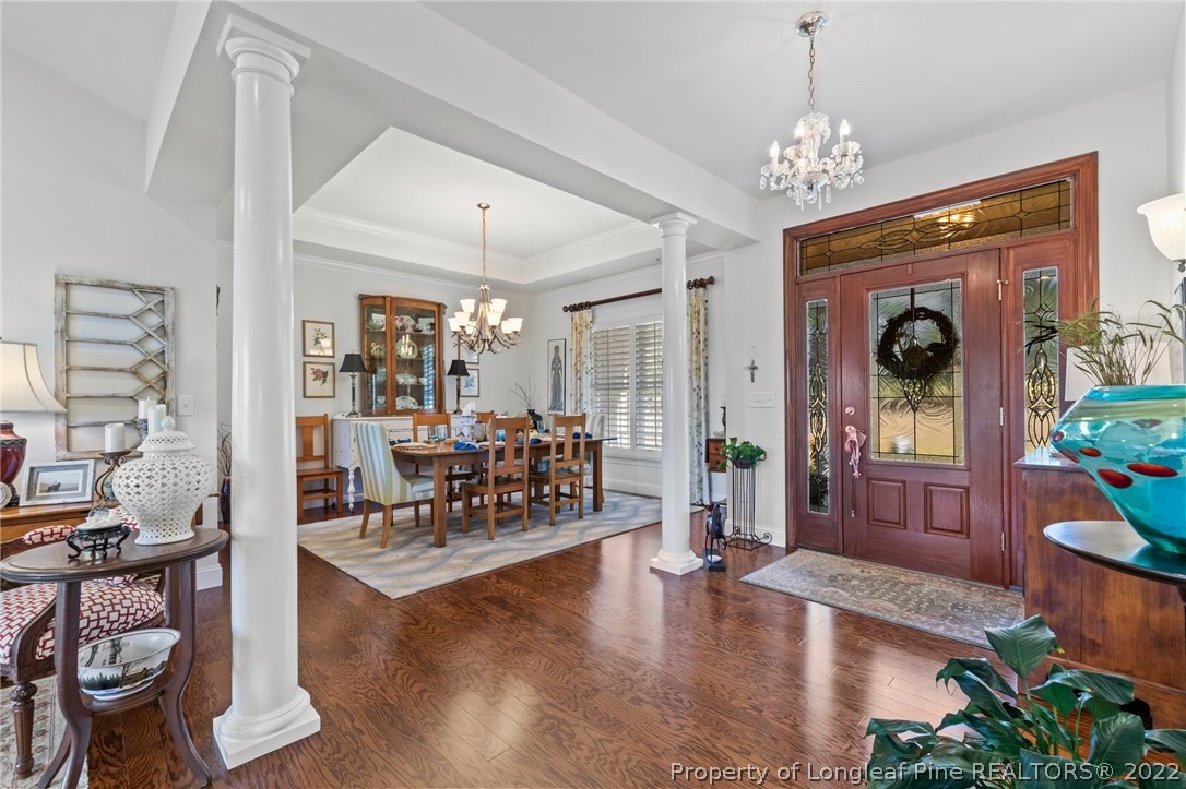 1570 Valley View Road Southern Pines, NC 28387 - Photo 10 of 44 a living room with furniture and a chandelier