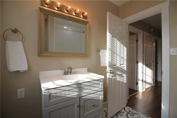 a bathroom with a sink and a mirror