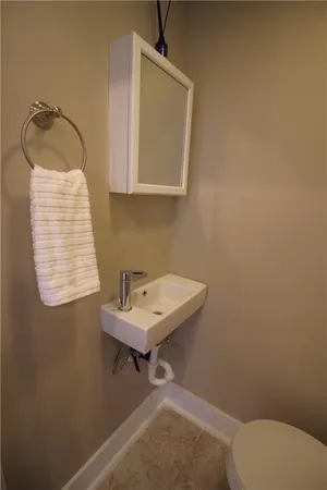 a bathroom with a sink toilet and vanity