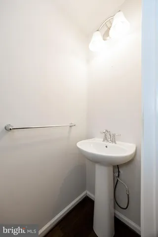 a bathroom with a sink and mirror
