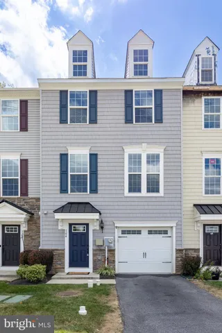 a view of a brick building with a yard