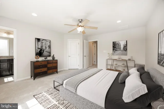 a bedroom with a bed and a couch