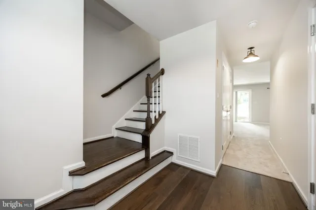 a view of an entryway with wooden floor
