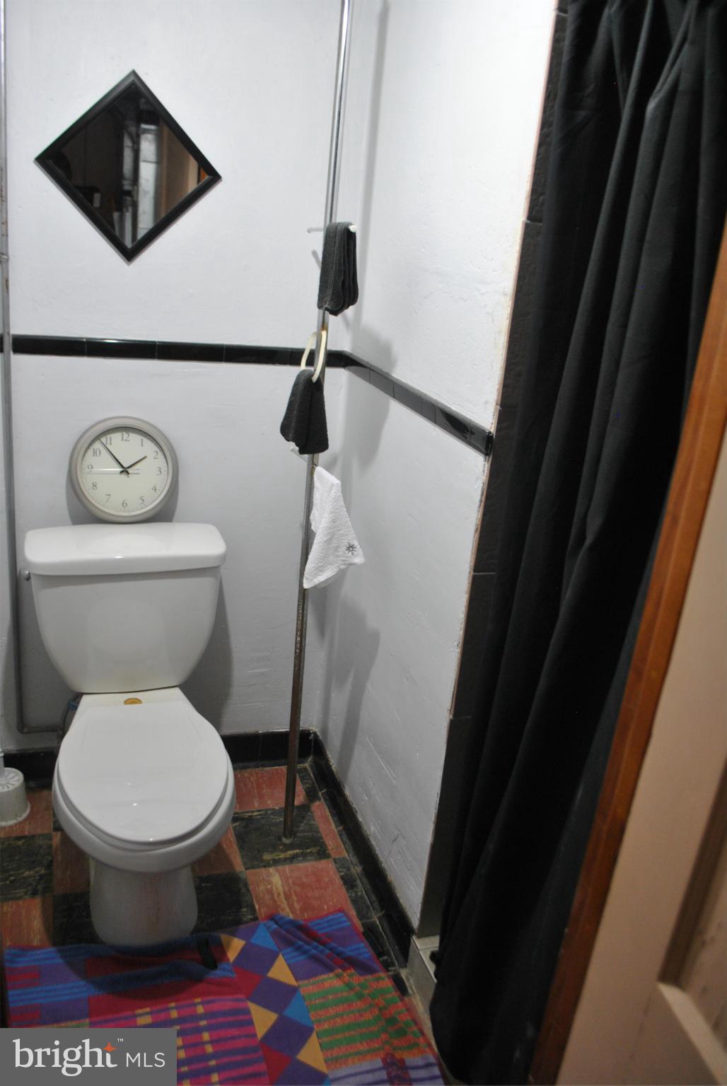 1810 Willann Road Baltimore, MD 21237 - Photo 15 of 21 a bathroom with a toilet and a shower