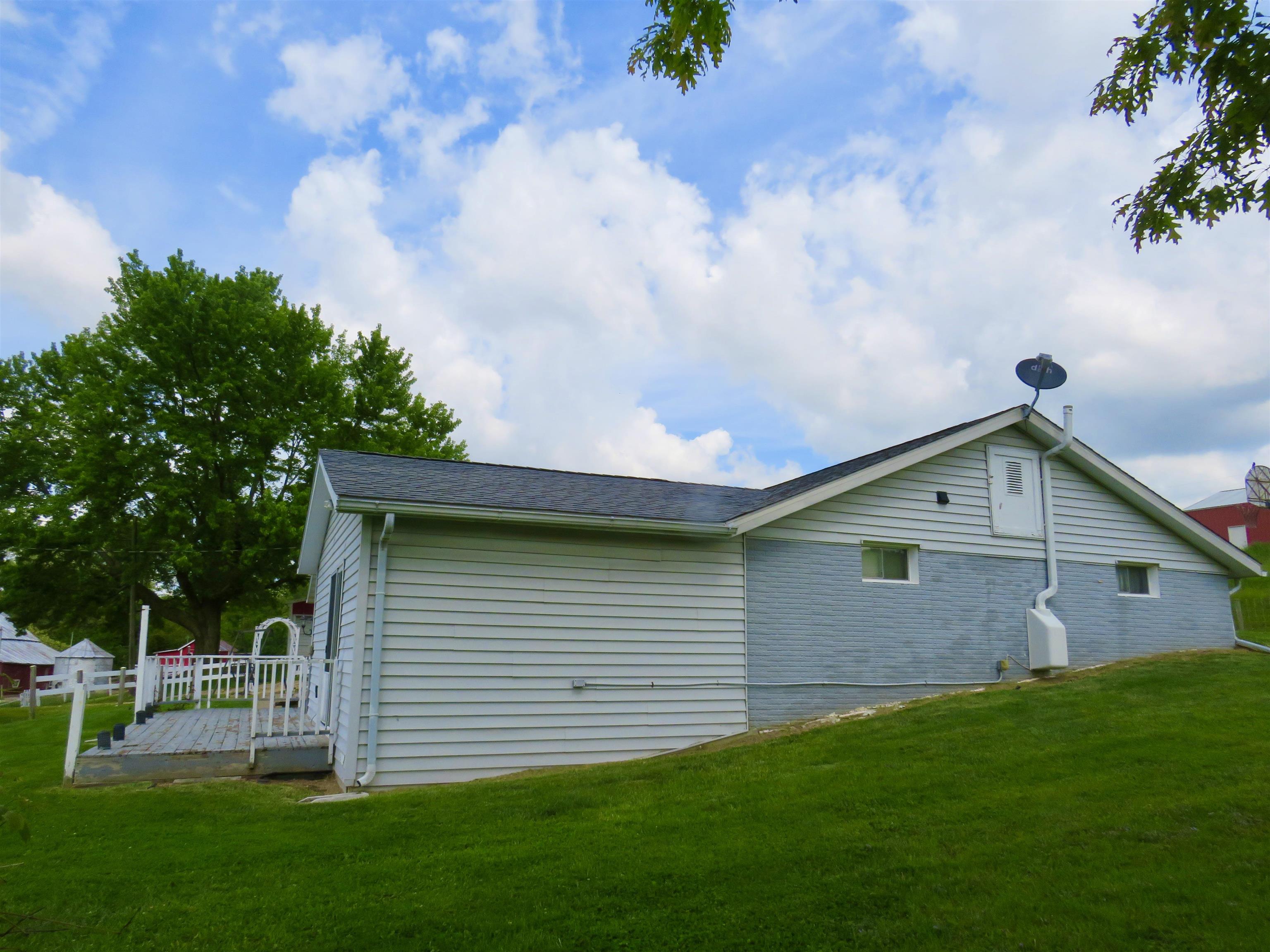 1139 Highway 20 Elizabeth, IL 61028 - Photo 11 of 88 a front view of a house with garden