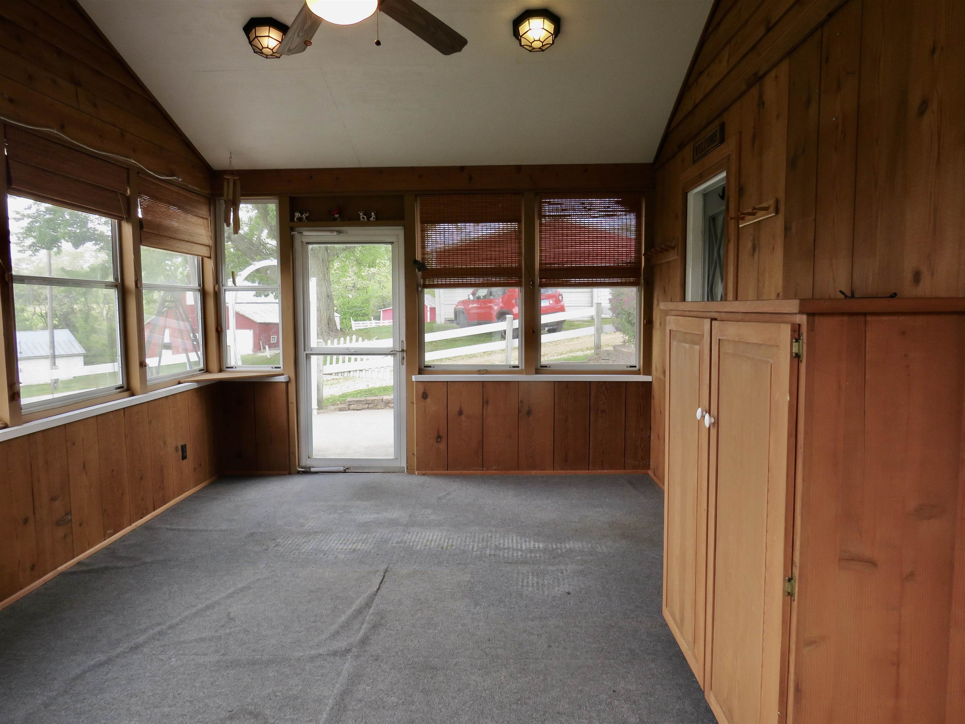 1139 Highway 20 Elizabeth, IL 61028 - Photo 16 of 88 a view of an empty room with a fireplace and a window
