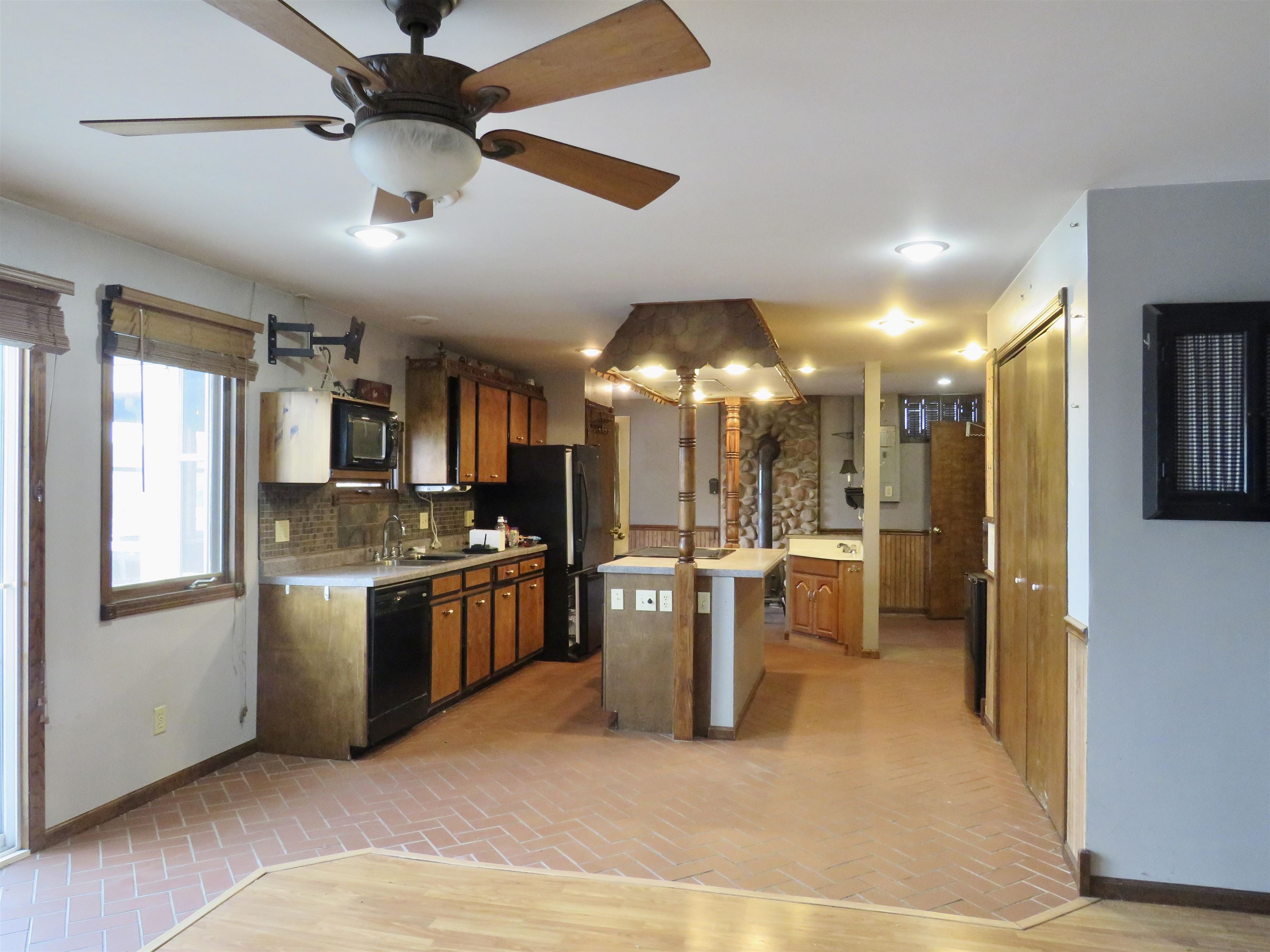 1139 Highway 20 Elizabeth, IL 61028 - Photo 21 of 88 a kitchen with stainless steel appliances kitchen island granite countertop a refrigerator a stove top oven a sink and dishwasher