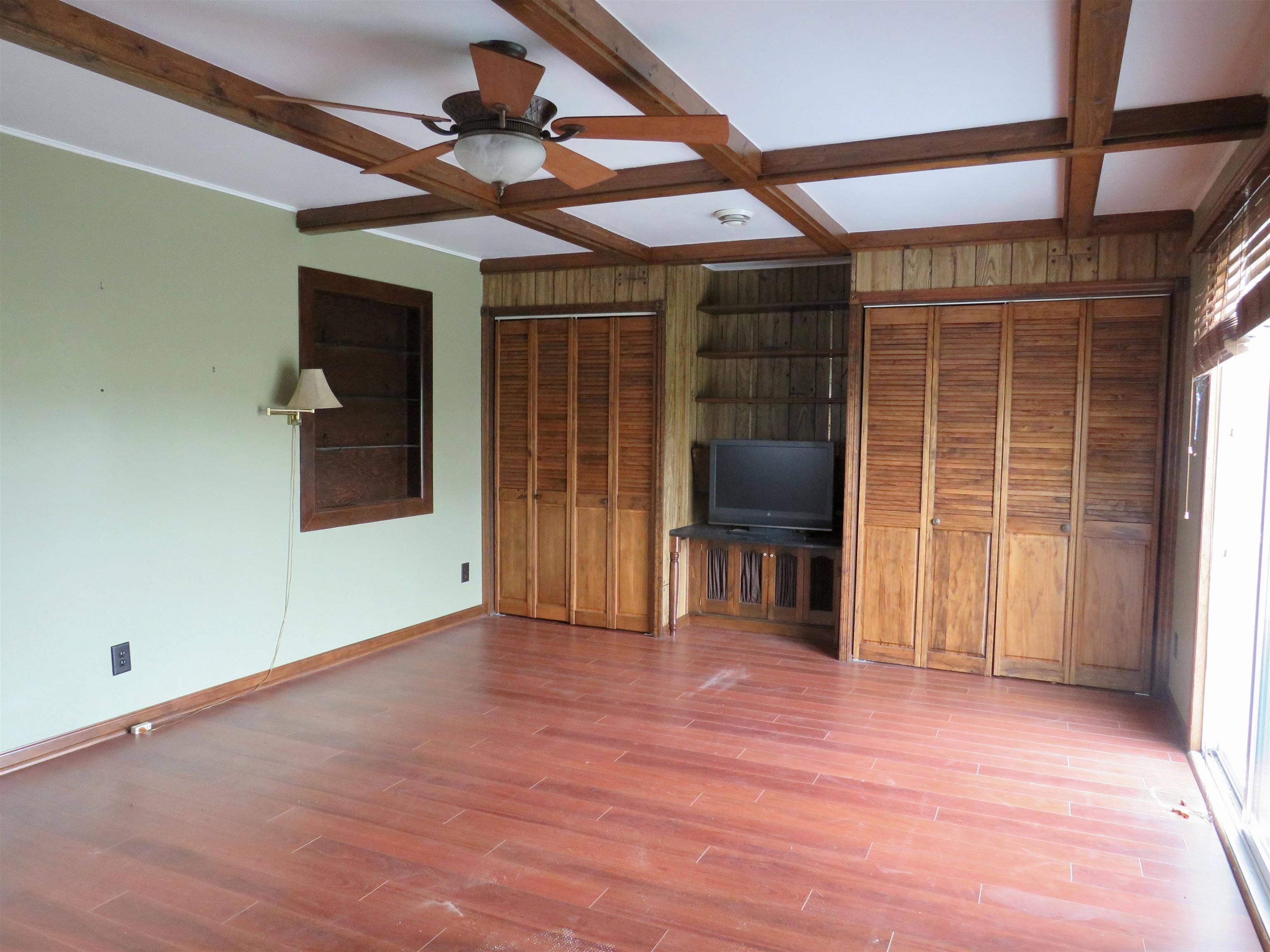 1139 Highway 20 Elizabeth, IL 61028 - Photo 25 of 88 a view of a livingroom with a chair and wooden floor