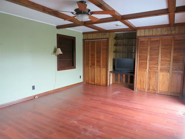 a bathroom with a toilet and shower