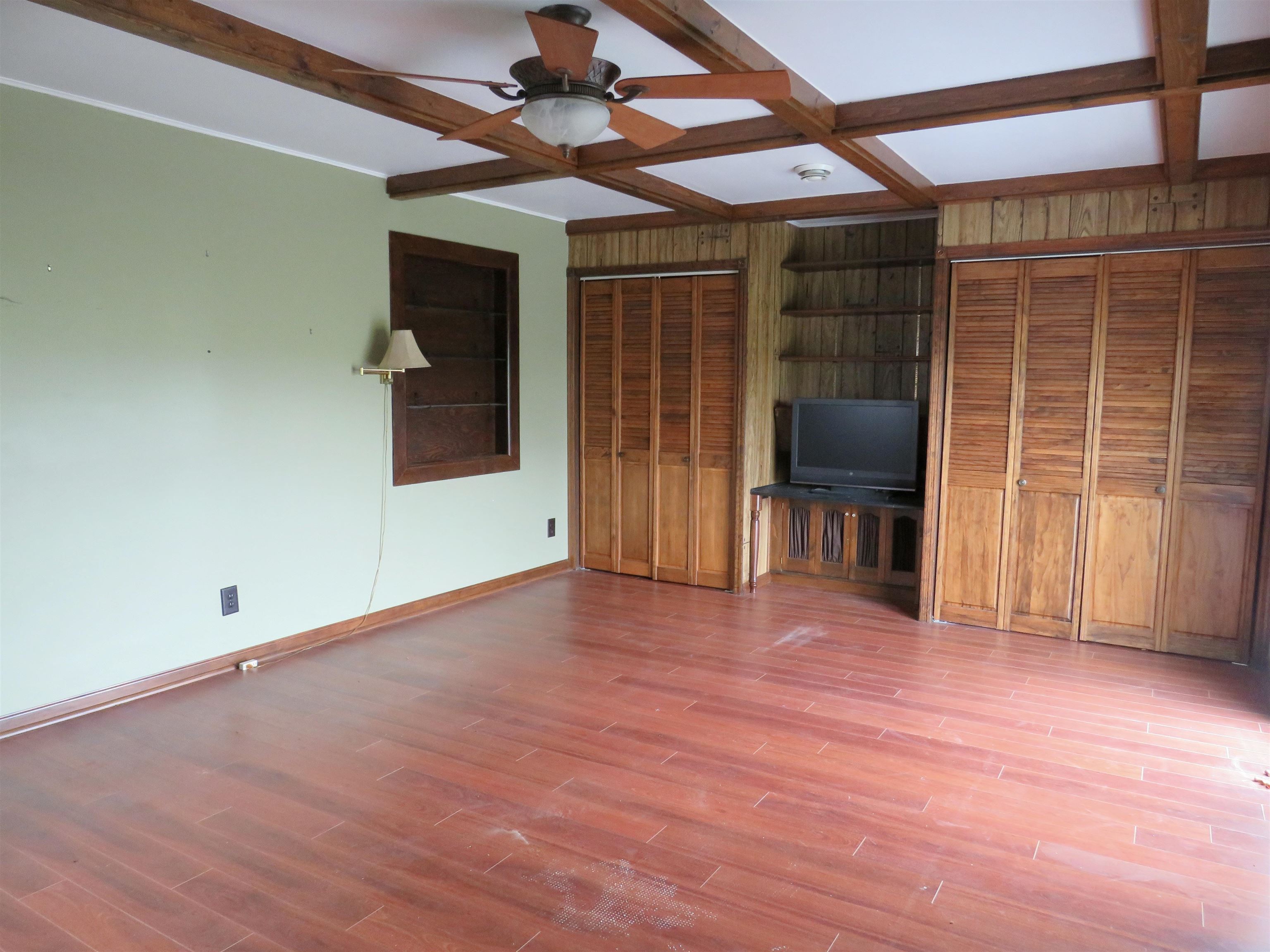 1139 Highway 20 Elizabeth, IL 61028 - Photo 26 of 88 a view of empty room with wooden floor and fan