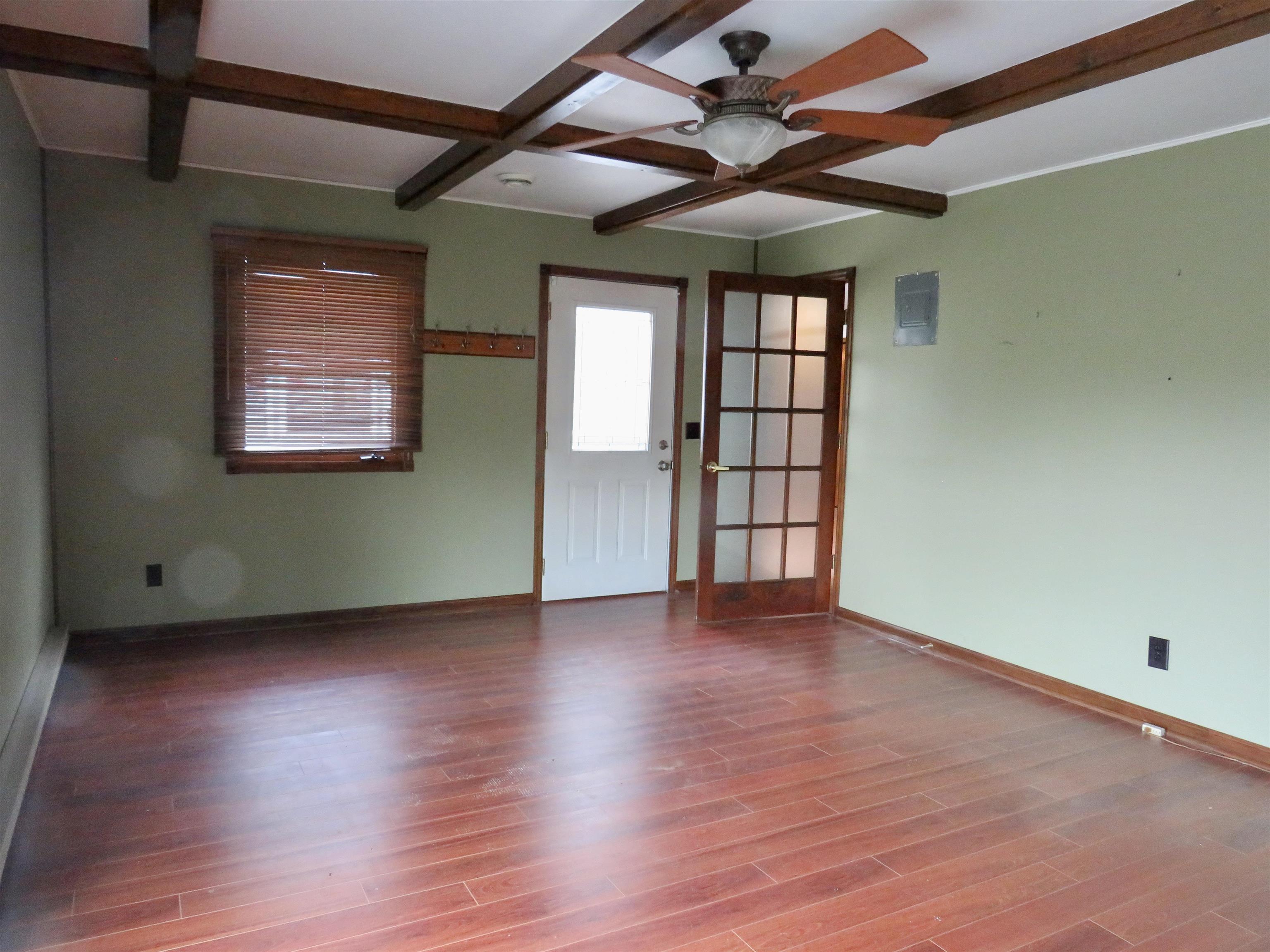 1139 Highway 20 Elizabeth, IL 61028 - Photo 28 of 88 an empty room with wooden floor and windows