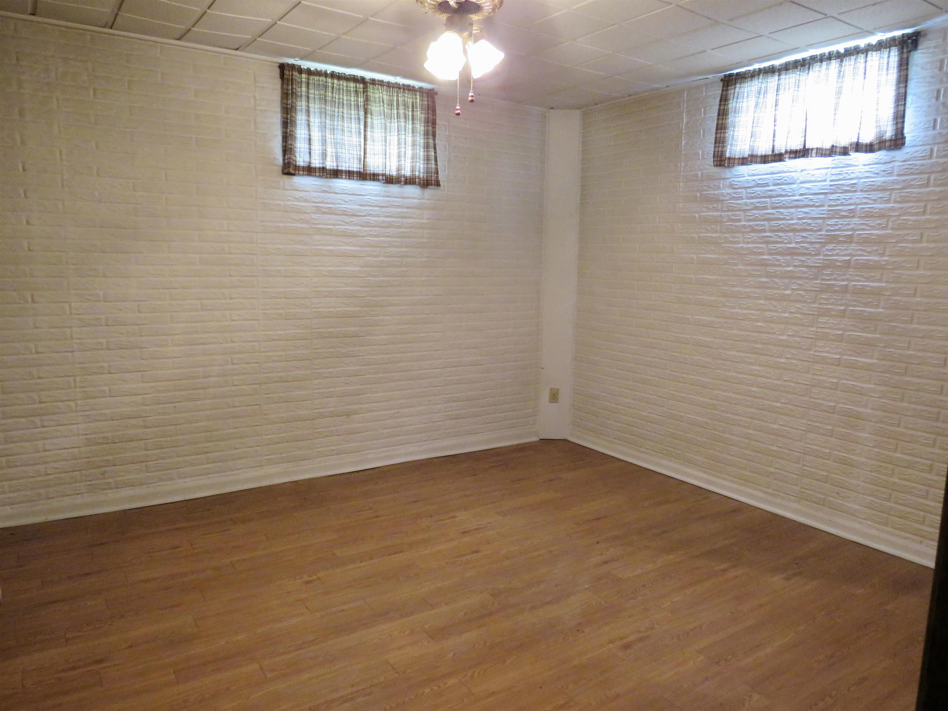 1139 Highway 20 Elizabeth, IL 61028 - Photo 29 of 88 a view of an empty room with wooden floor and a window