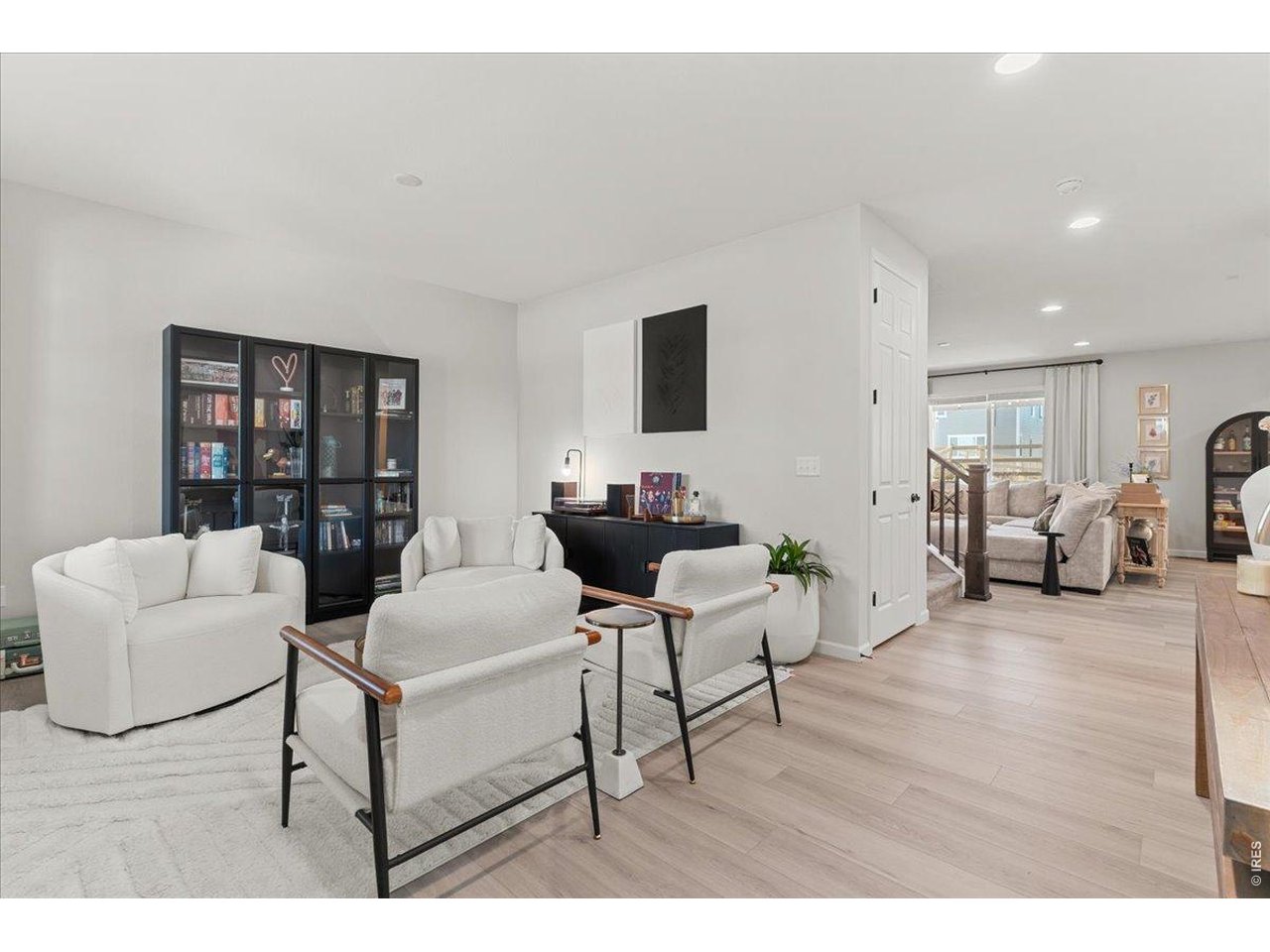 946 Rustling Street Windsor, CO 80550 - Photo 7 of 50 View from front door upon entry living room/flex room