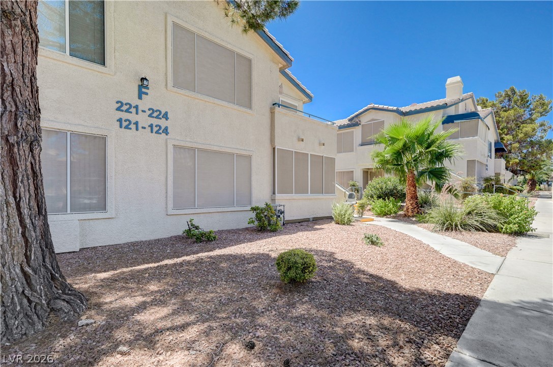 3425 East Russell Road, Unit 223 Las Vegas, NV 89120 - Photo 38 of 47 A desert-friendly landscape surrounds this multi-story stucco structure, complete with a meandering sidewalk.