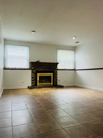 a view of a room with a fireplace