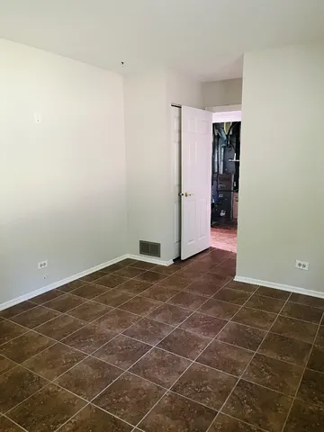 a view of an empty room with a sink