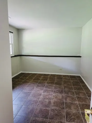 a view of a refrigerator in a bathroom