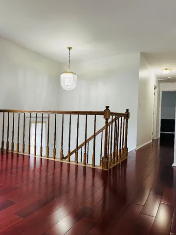 a view of entryway with wooden floor