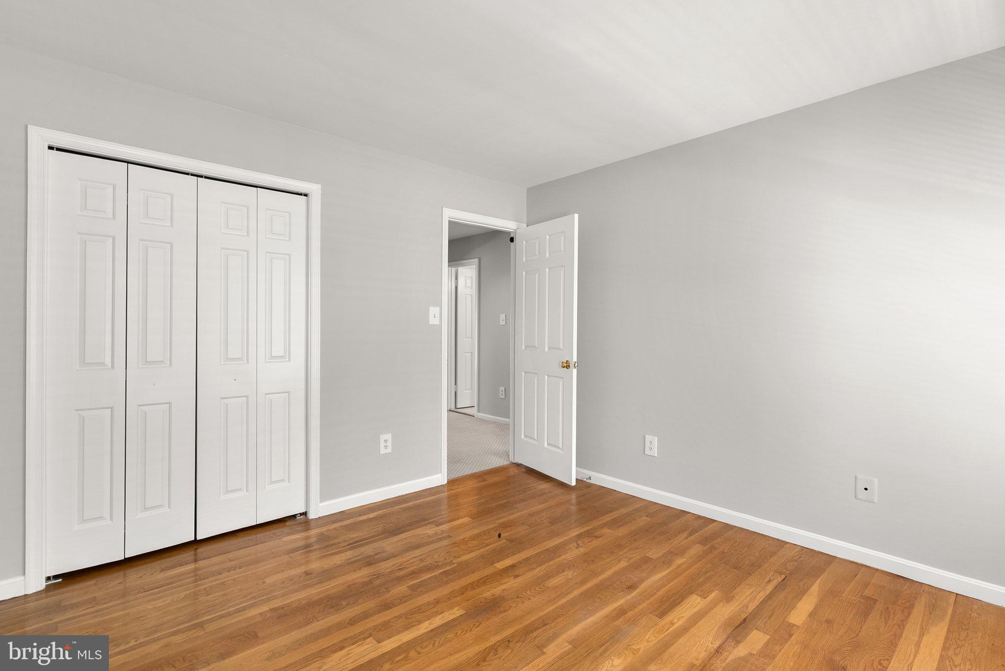 943 Willowleaf Way Potomac, MD 20854 - Photo 20 of 49 a view of an empty room with wooden floor