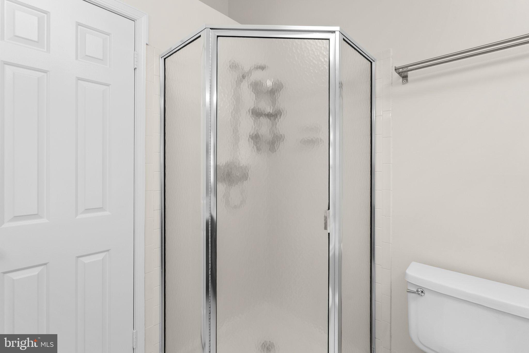 943 Willowleaf Way Potomac, MD 20854 - Photo 28 of 49 a bathroom with a shower and a toilet