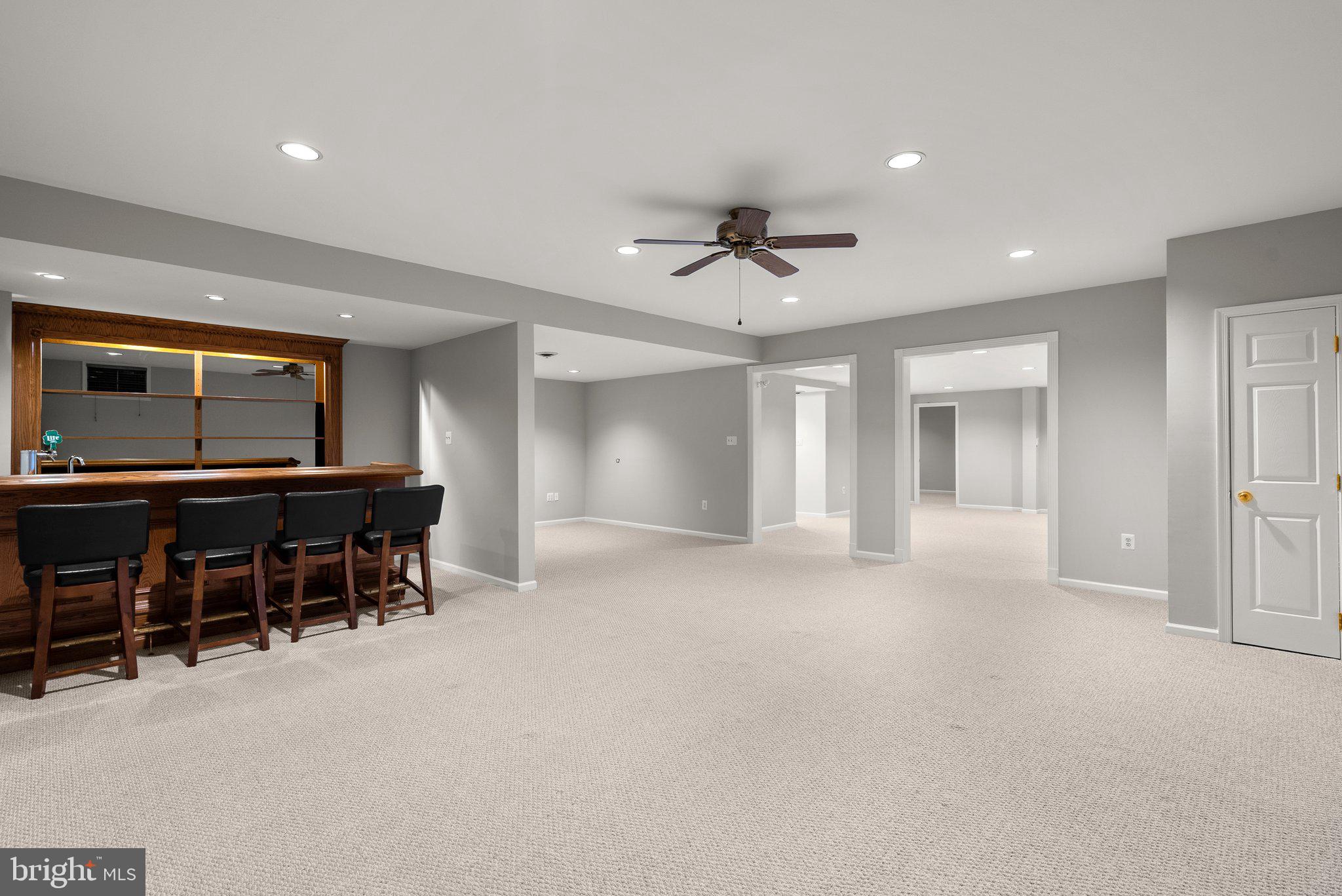 943 Willowleaf Way Potomac, MD 20854 - Photo 34 of 49 a view of a livingroom with furniture and a refrigerator